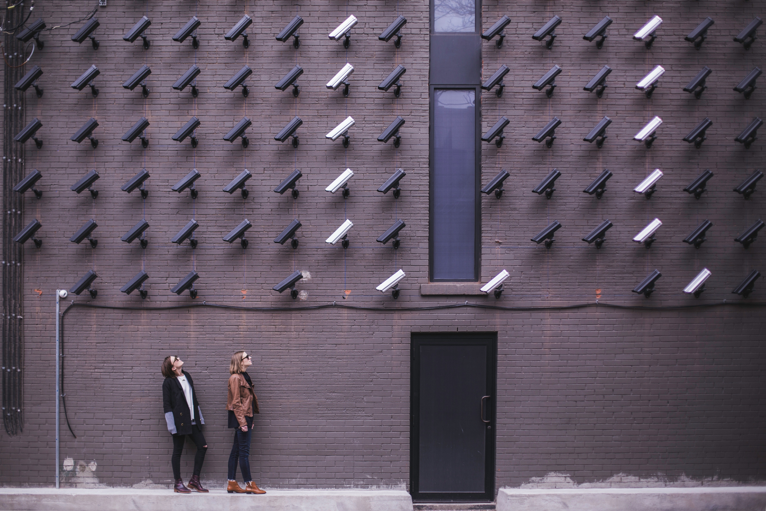 a picture showing a wall of CCTV